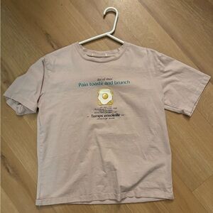 Pink women’s graphic tee with French design